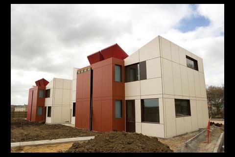 Triangular red eco hats on the roof declare the home’s green credentials